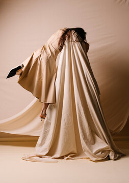 Draped Figure in Beige Fabric Couture