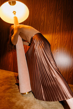 Elegant Fashion Pose With Dramatic Warm Lighting