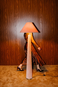 Night Walk Behind Lamp In Retro Room