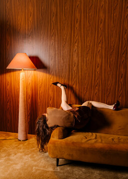 Relaxed Figure On Retro Orange Sofa