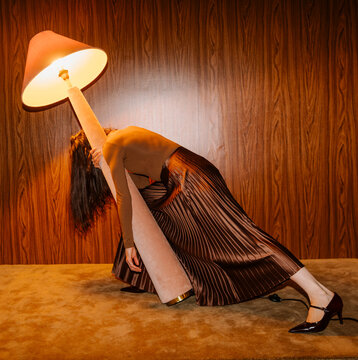 Dramatic Lamp Lean Portrait in Warm Room