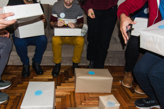 Friends opening presents from secret santa