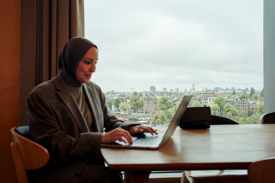 Working Remotely With a City View From a Modern Office