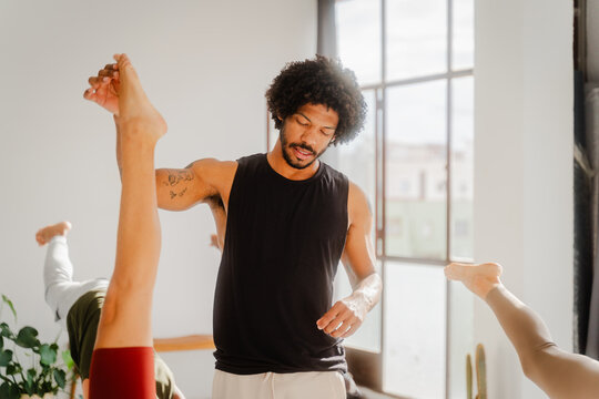 Yoga teacher gives instructions