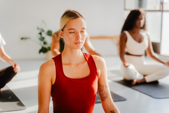 Portrait of a woman in a group meditation