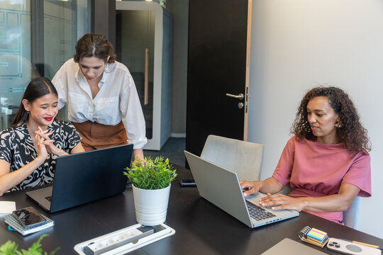 Team Collaborating in a Modern Office Setting During a Work Session