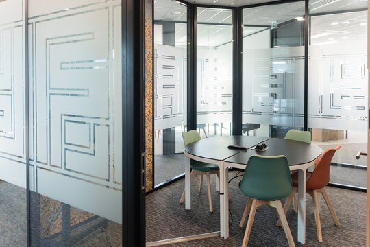 Modern Meeting Space With Colorful Chairs in an Office