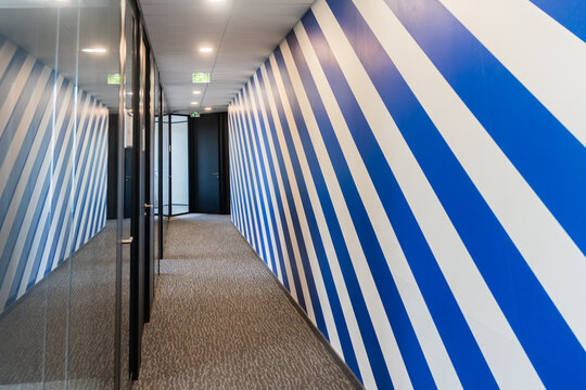 Modern Office Hallway With Blue and White Striped Walls