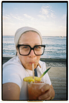 Selfish Enjoying a Drink by the Ocean