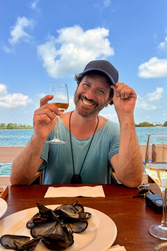 Man having lunch on beach restaurant