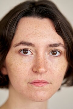 Close up of a Young Woman With Freckles and Short Hair