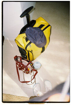 Traveler standing next to packed bags