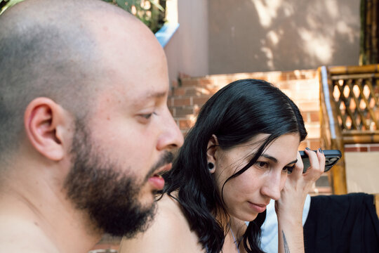 Friends Enjoying a Sunny Day at a Backyard Gathering in Summer