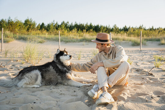 Dog owner walking with his pet.