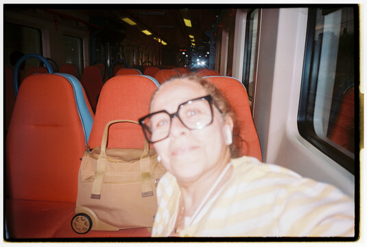Woman Takes a Selfie on a Nearly Empty Train