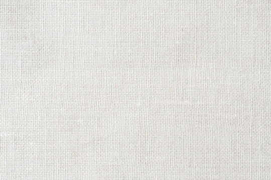 White jute burlap, hessian sackcloth, or cheescloth, cheese cloth cotton gauze fabric cloth textile texture pattern background in white light color