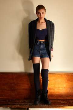 Fashion Editorial Pose on Wooden Bench
