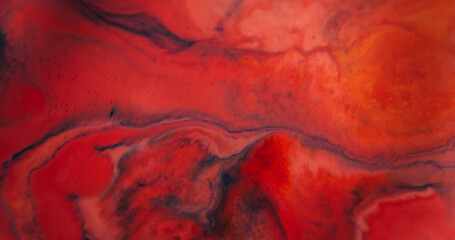 Ink flow defocused. Watercolor drop. Black wave pigment spill on red marble background. Bright dye abstract dissolving in art color emulsion.