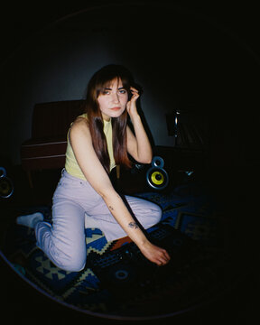 Gen Z DJ Practicing at Home with Fisheye Lens