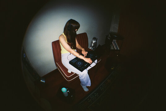 Overhead Fisheye: DJ and Curious Cat in Home Studio