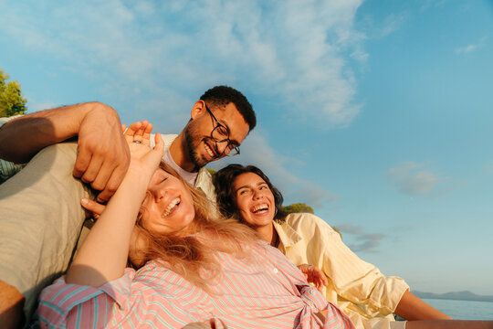 Happy best friends laughing together outdoors