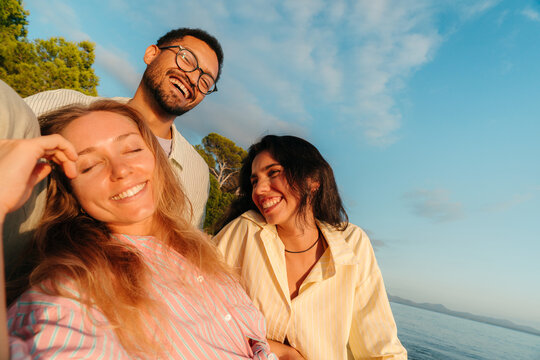 Happy best friends laughing together outdoors