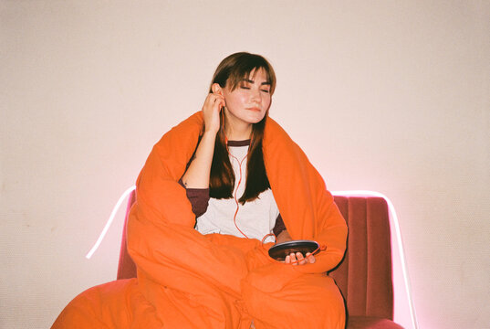  Lost in Music: Woman with CD Player and Headphones