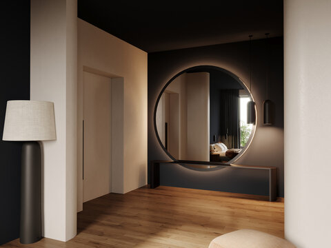 Hallway in hotel or home. Large accent round mirror, long entry table