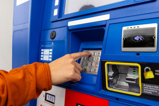 Hand keypad working gas pump at Gas Station 
