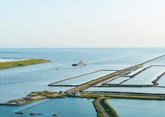 Obraz premium Aerial photo of the cargo ship setting sail