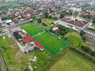 aerial shot of a mini soccer field in a densely populated area of ​​Yogyakarta