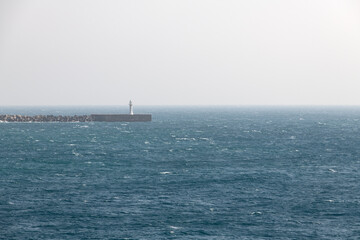 Obraz premium idyllic seascape with a lighthouse