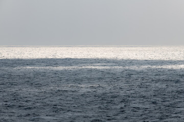 idyllic seascape with sunlight-reflecting sea
