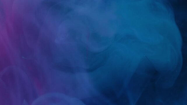 Fog mix. Cracked light bulb. Defocused blue purple neon color paint fluid broken glass swirling water spreading on abstract art background.