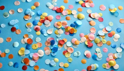 Colorful Confetti Scattered On A Light Blue Surface