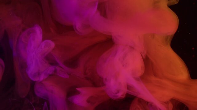 Smoke drop. Cloud vapor ink. Defocused pink purple yellow color glitter rainbow splash fume spreading on abstract acrylic art neon background.