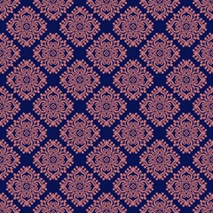 Fototapeta premium Classic repeating damask ornament pattern in soft pink over dark blue background. Ideal for textile, wallpaper and luxury branding design.