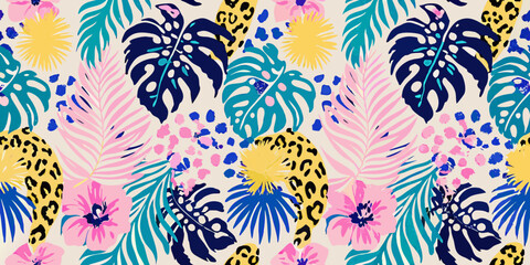 Tropical leaves flowers and animal print form a vibrant colorful pattern © Mamata
