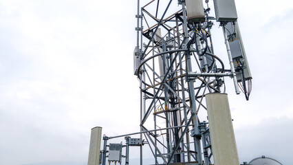 Cellular Radio Masts and Transmitters Antennas on Communication Tower. Aerial View Telecommunications Infrastructure