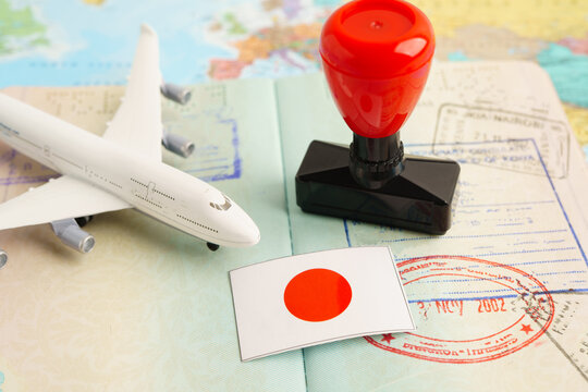 Japan passport with approved stamp on document for tourism to immigration at airport in country.