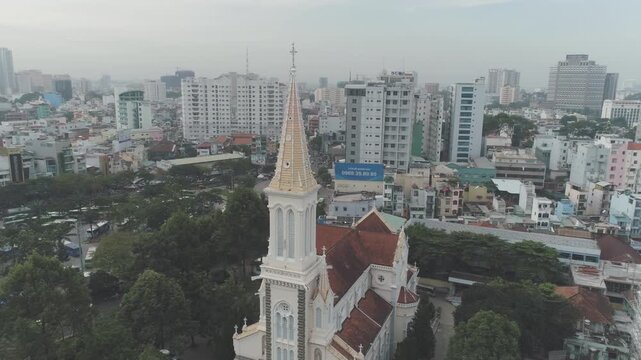 Aerial view of Cho Quan Church with surrounding urban district in Ho Chi Minh City, historic religious architecture in dense cityscape