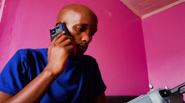 Africa masai man enjoying using his cellphone