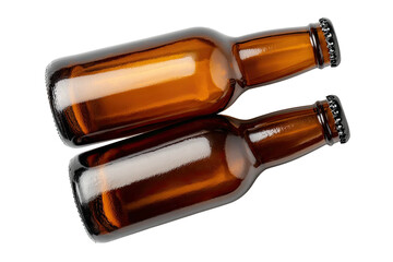 Overhead shot of two empty, brown glass bottles with dark caps stacked on each other