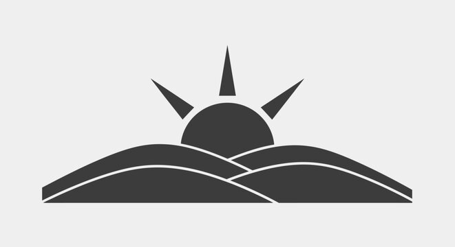 Black sun rising over hills.