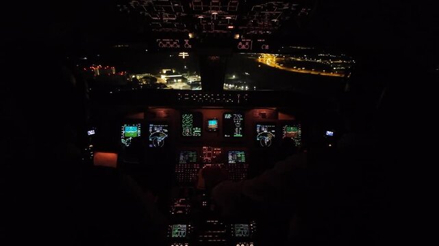 Immersive cockpit view in a real time night approach to Ibiza airport runway in a windy night with severe turbulence. Runway 24 ahead.