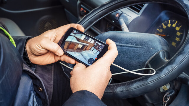 Using mobile device to view security camera footage in a vehicle