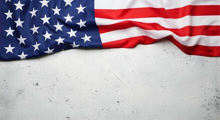 Obraz premium American flag draped over a textured gray background with copy space for text or graphics to convey patriotic themes and celebrations.