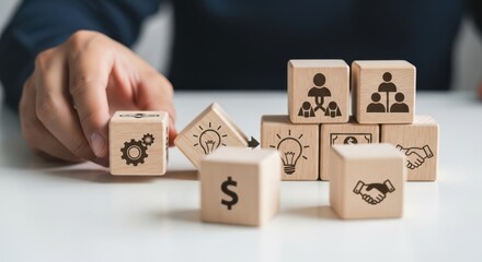 Organizational change readiness and showing cubes prepared for a major structural shift using wooden cubes, symbolic icons, human hand, natural depth of field, soft blurred background, clean white des