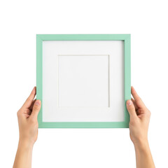 Obraz premium A person holding a blank white canvas framed by a mint green border. isolated on transparent background