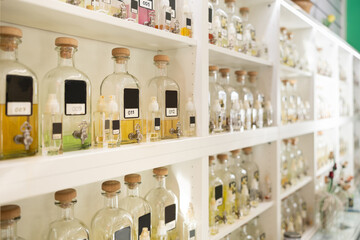 Obraz premium Variety bottles of perfume for sale on shelves of cosmetic shop